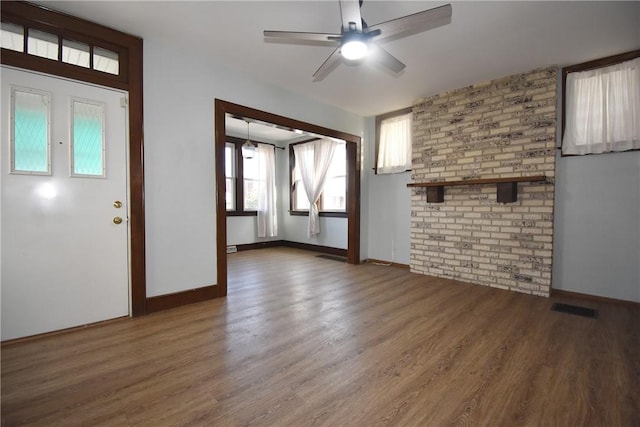 unfurnished living room featuring ceiling fan and hardwood / wood-style floors