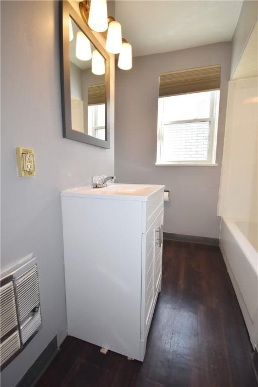 bathroom with vanity and hardwood / wood-style floors