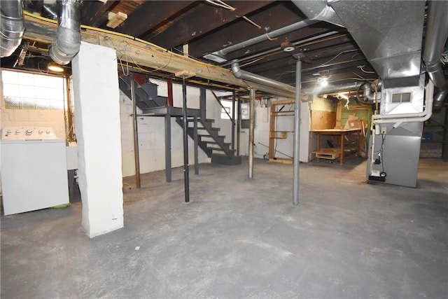 basement featuring washer / clothes dryer and heating unit