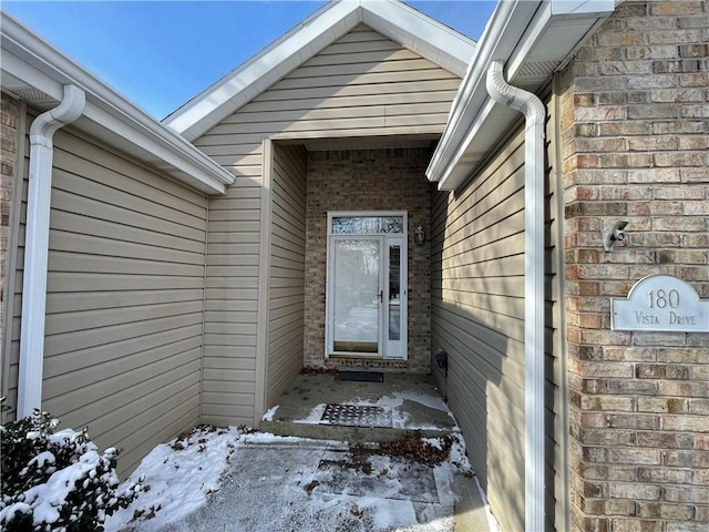 view of snow covered property entrance