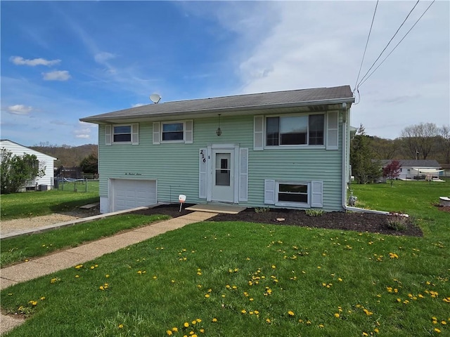 216 Karen Dr, Allegheny Twp Wml, PA 15613 - raised ranch featuring a front yard and a garage