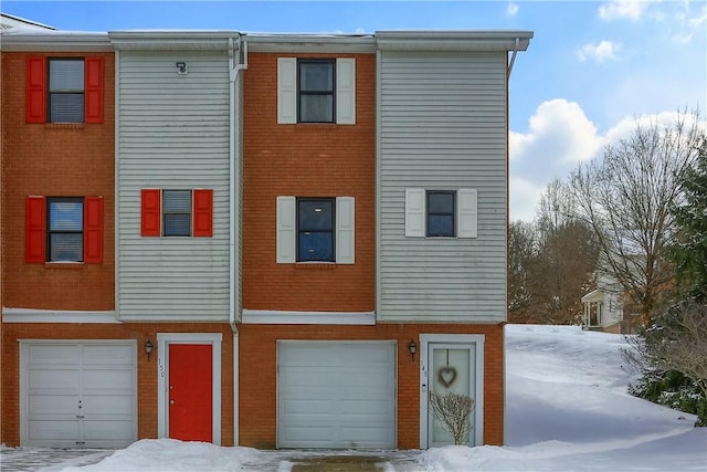 multi unit property featuring a garage