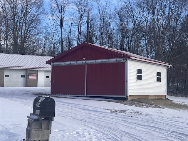 view of snow covered garage