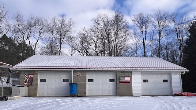 view of snow covered garage