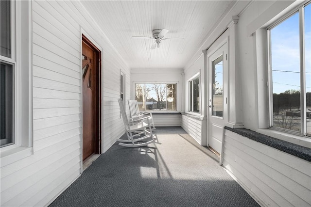 sunroom / solarium with ceiling fan