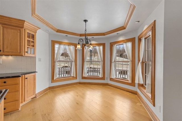 340 Old Scales Rd, South Franklin, PA 15301 - unfurnished dining area featuring a raised ceiling, light wood-type flooring, a chandelier, and ornamental molding