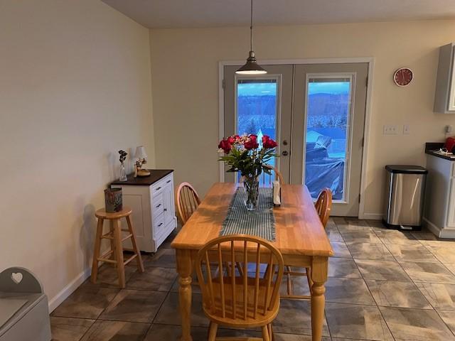 tiled dining room with french doors