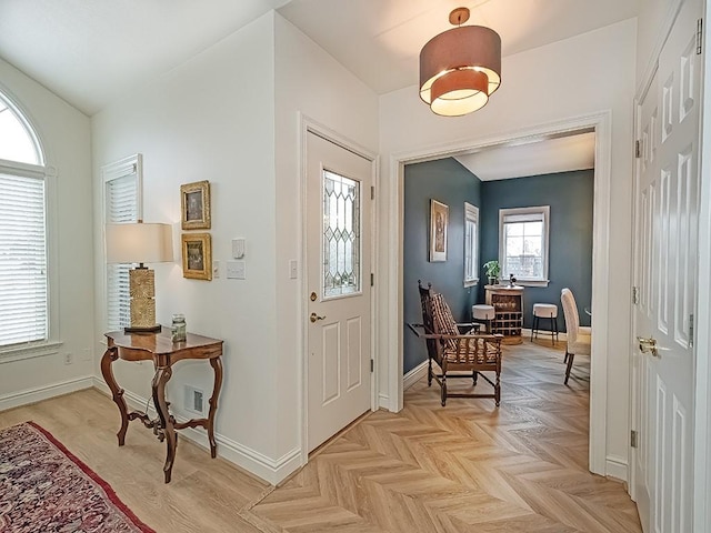 entryway with light parquet flooring