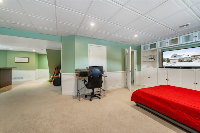 bedroom featuring light carpet