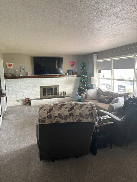 carpeted living room featuring a fireplace and a textured ceiling