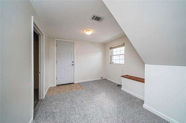 additional living space featuring light colored carpet