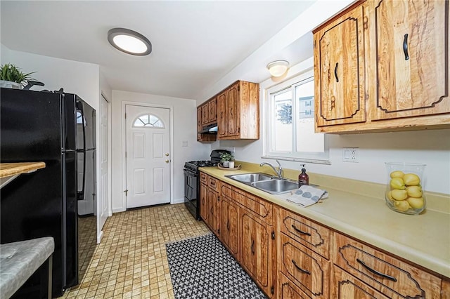 kitchen with sink and black appliances