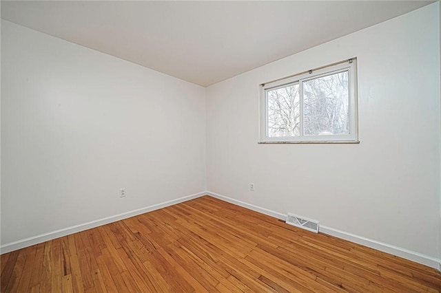 empty room featuring wood-type flooring