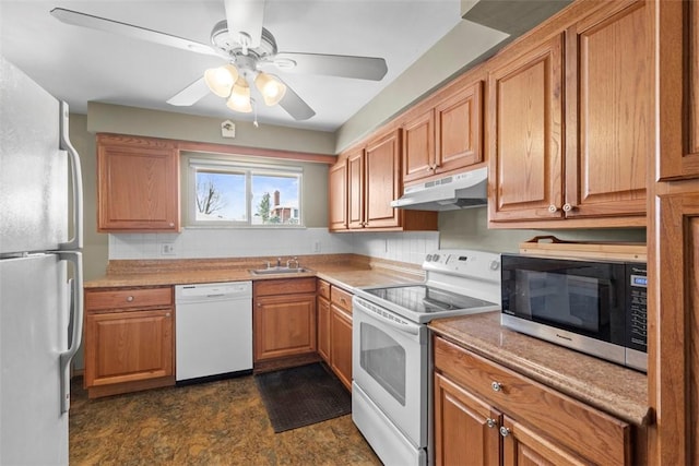 kitchen with sink, backsplash, white appliances, and ceiling fan