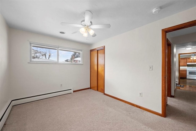 unfurnished bedroom featuring ceiling fan, carpet flooring, and a closet