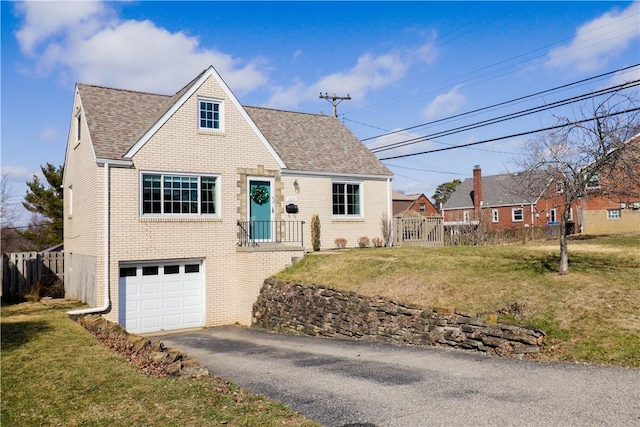 view of front facade with a front lawn and a garage