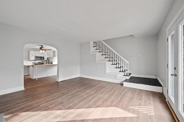 foyer entrance with hardwood / wood-style flooring and ceiling fan