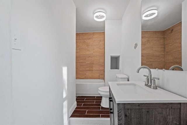 full bathroom featuring toilet, vanity, and tiled shower / bath combo