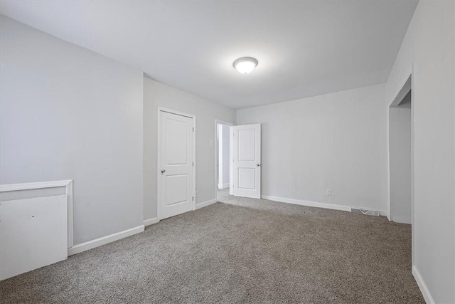 unfurnished room featuring carpet floors