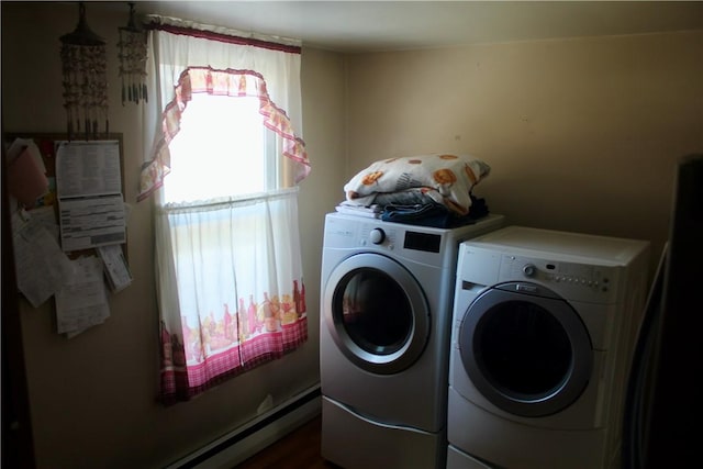 washroom featuring baseboard heating and washing machine and dryer