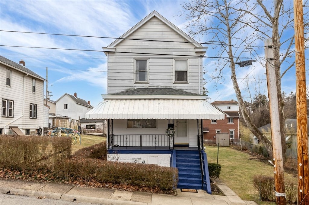 view of front of house featuring a front lawn and a porch