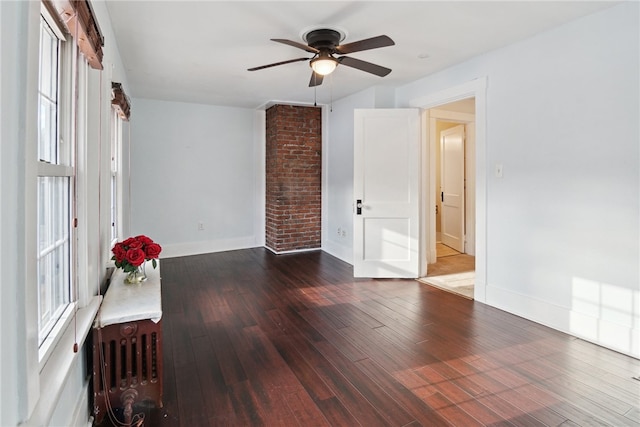 interior space with ceiling fan, radiator heating unit, wood finished floors, and baseboards