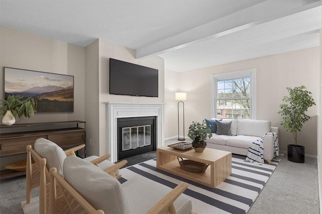 carpeted living room featuring beamed ceiling