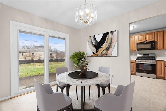 dining space with a notable chandelier