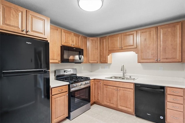 kitchen with sink and black appliances