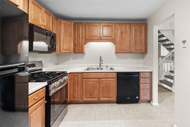 kitchen with sink and black appliances