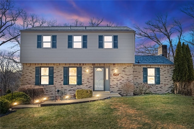 view of front of home with a lawn