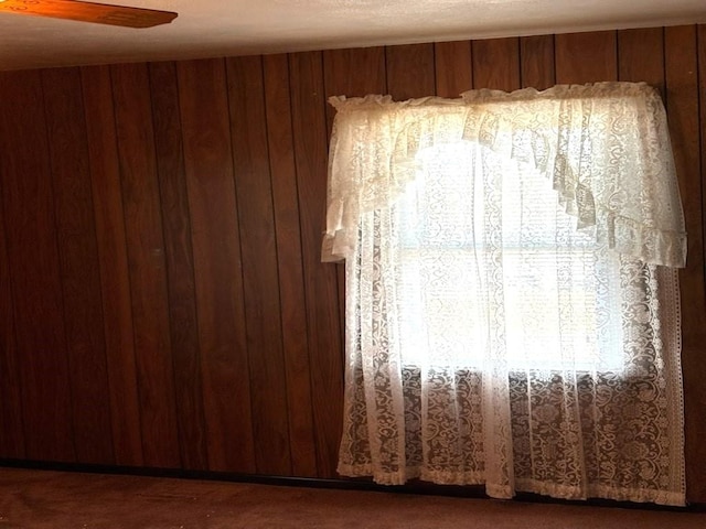 empty room with wood walls