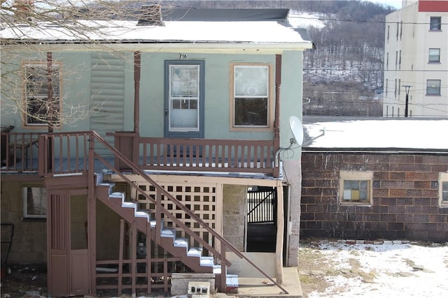 view of snow covered property entrance