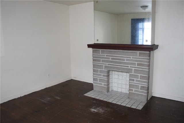 unfurnished living room with dark hardwood / wood-style floors