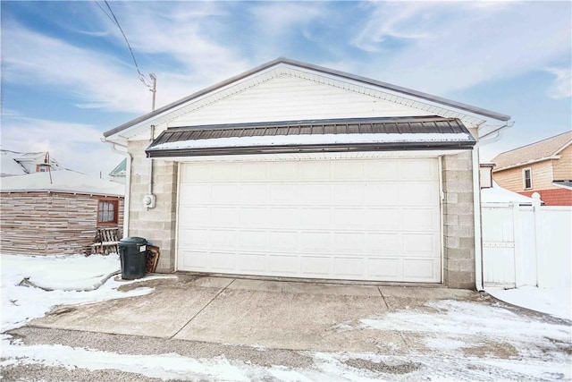 view of snow covered garage