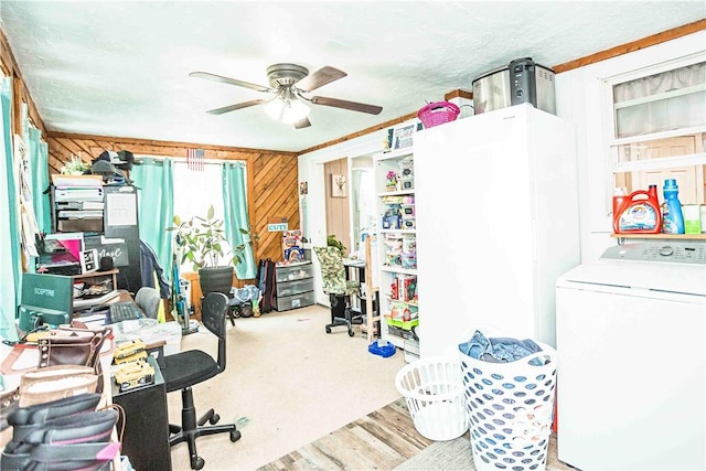 office area with ceiling fan, washer / clothes dryer, and wooden walls