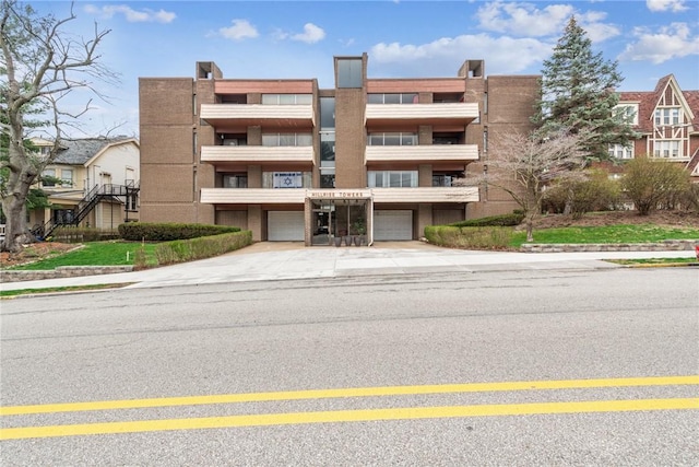 5841 Morrowfield Ave Unit 206, Squirrel Hill, PA 15217 - view of building exterior featuring a garage and concrete driveway