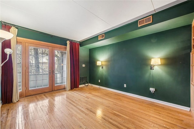 5841 Morrowfield Ave Unit 206, Squirrel Hill, PA 15217 - unfurnished room with french doors, visible vents, baseboards, and hardwood / wood-style flooring
