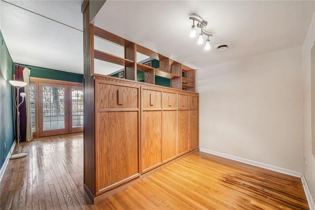 5841 Morrowfield Ave Unit 206, Squirrel Hill, PA 15217 - unfurnished bedroom featuring light wood-style floors, baseboards, visible vents, and french doors