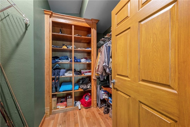 walk in closet featuring light hardwood / wood-style flooring