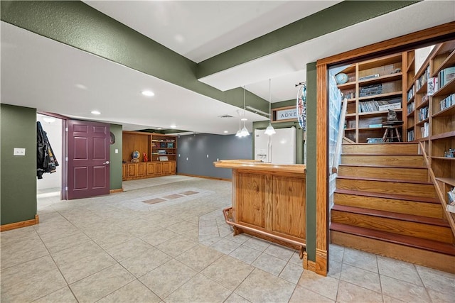 interior space with decorative light fixtures and light tile patterned floors