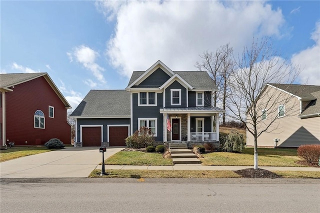 view of front of house featuring covered porch, a front lawn, and a garage