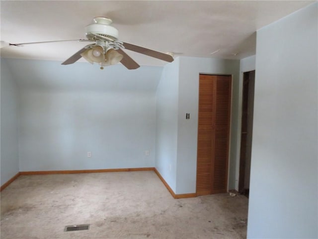 unfurnished room featuring a ceiling fan, light carpet, visible vents, and baseboards