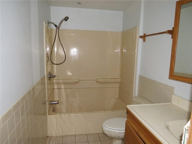 bathroom with tile patterned flooring, vanity, toilet, and shower / bathtub combination