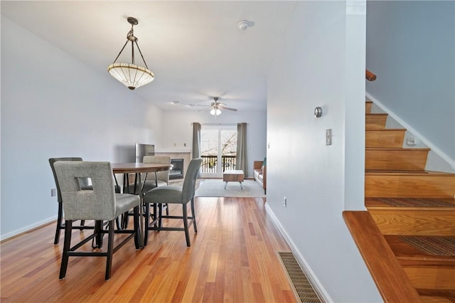 dining area featuring ceiling fan and light hardwood / wood-style floors