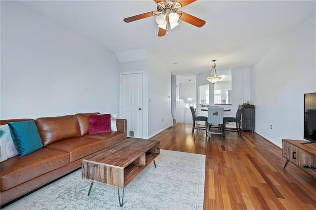 living room with ceiling fan and wood-type flooring