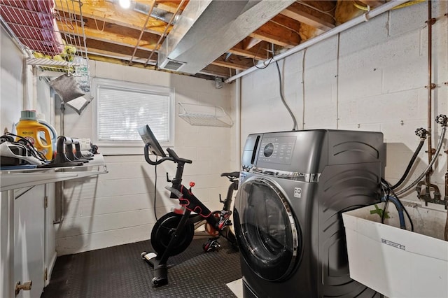 laundry room featuring sink and washer / clothes dryer