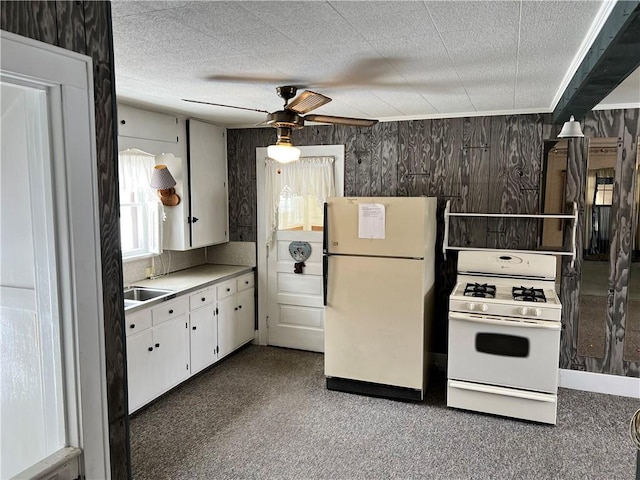 kitchen with ceiling fan, white appliances, white cabinetry, and a textured ceiling