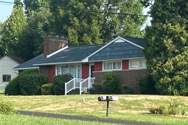 ranch-style home with a front lawn