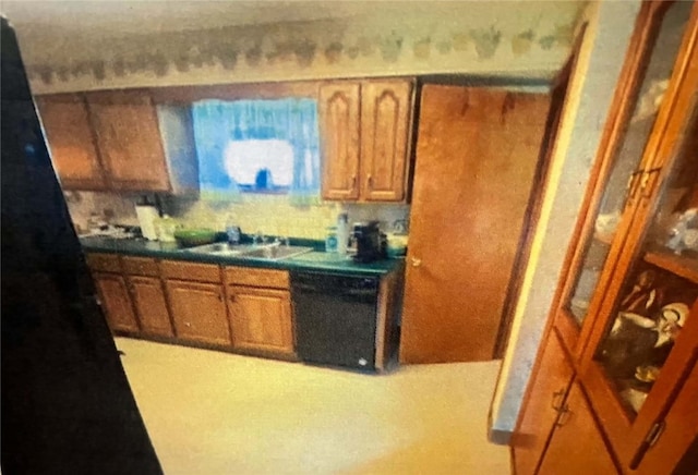 kitchen featuring sink and black dishwasher